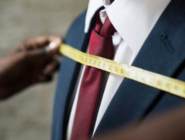 Measure clients to ensure that clothing aligns and fit them properly